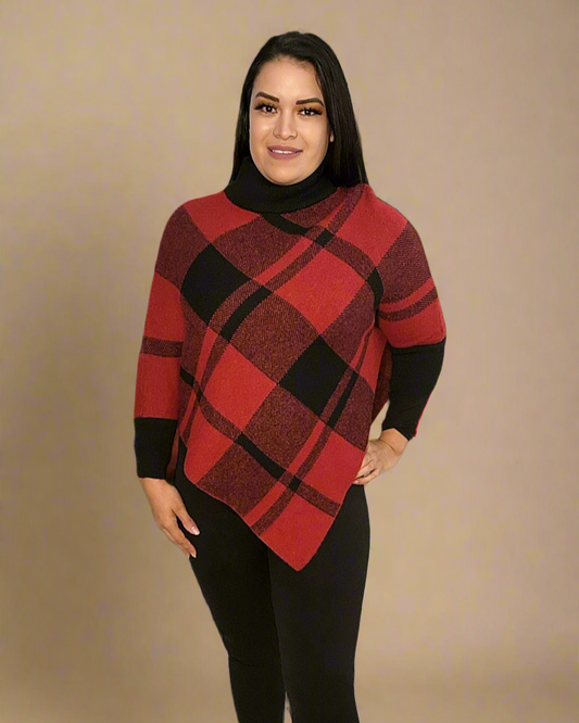 Woman wearing a red and black plaid sweater with a beige background
