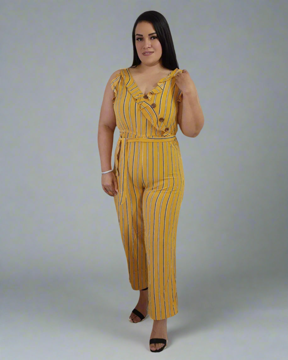 Woman wearing a yellow striped jumpsuit on a gray background