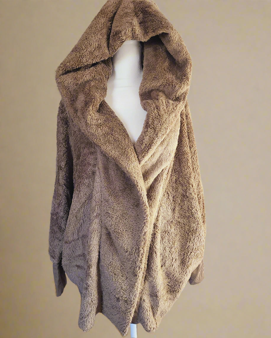 Brown textured scarf on a mannequin against a white background