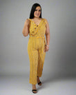 Woman wearing a yellow striped jumpsuit on a gray background